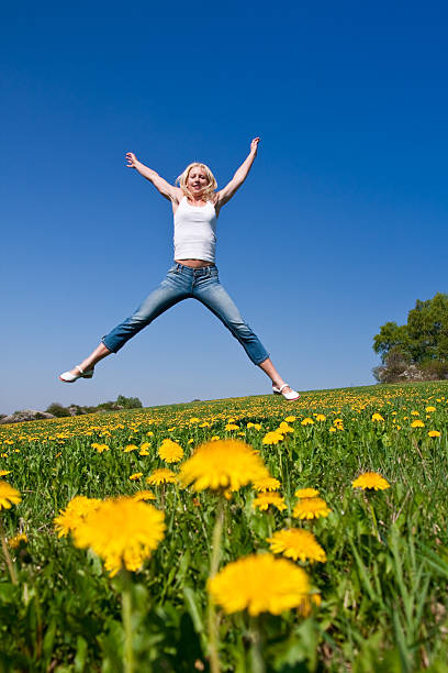 istock happy young woman on meadow 97931747