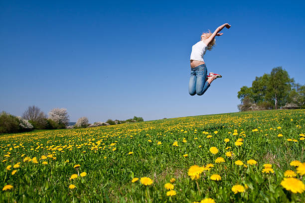 istock happy young woman on meadow 97931752
