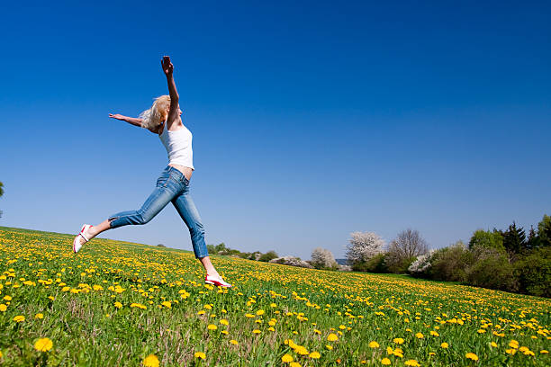 istock happy young woman on meadow 97931774