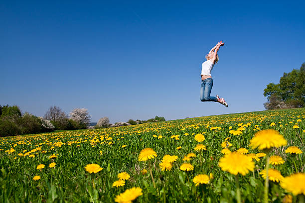 istock happy young woman on meadow 97931796