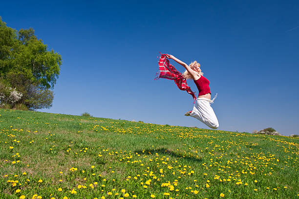 istock young woman with red scarf on meadow 97931798