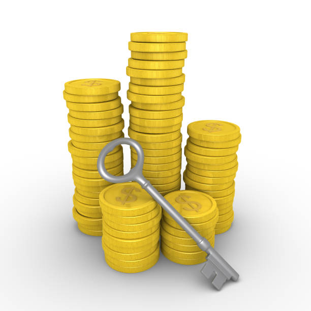istock Pile of dollar coins and key 979319534