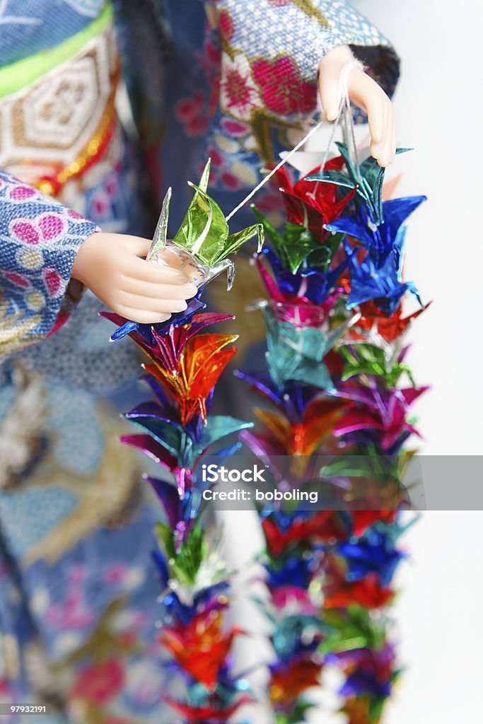 Making Senbazuru (a thousand origami cranes)  Color Image Stock Photo