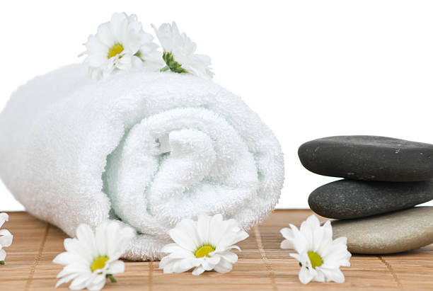 istock Chamomile flowers and massage stones 97932301