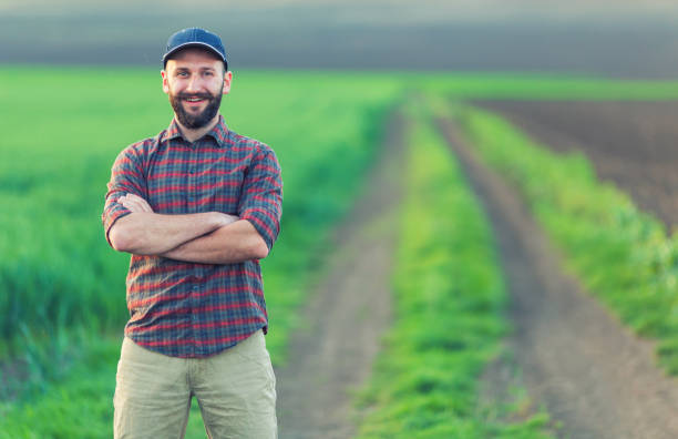 istock Farmer standing with arms crossed 979327552