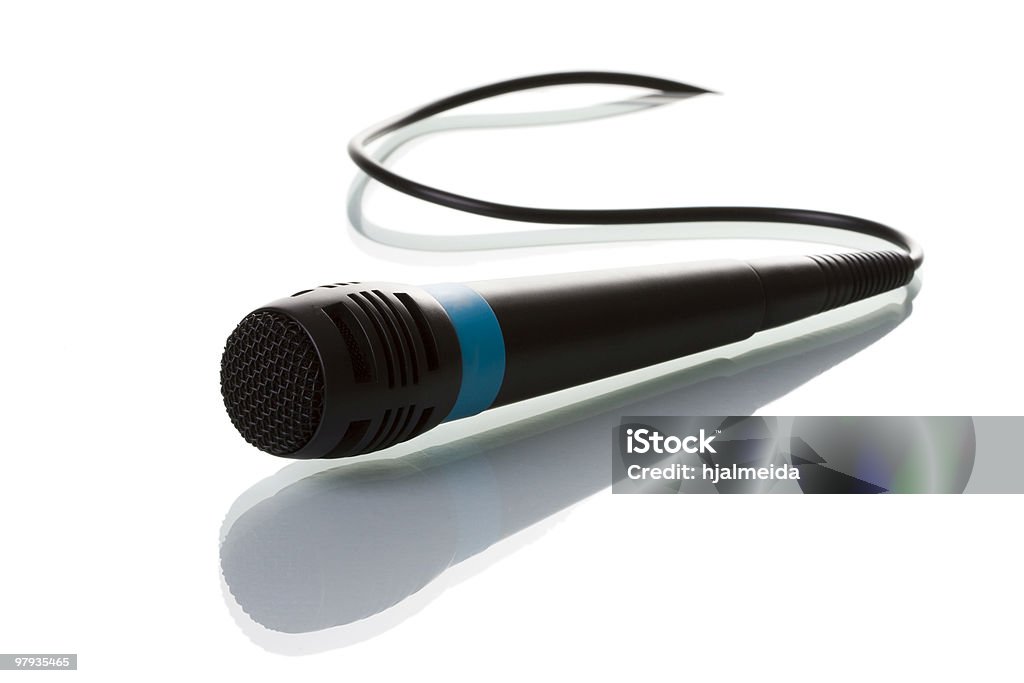 Isolated microphone a isolated microphone with his reflection (selective and soft focus) Audio Equipment Stock Photo