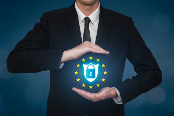 istock Business man covering a security data lock on a shield. Safety gdpr on the web 979357120