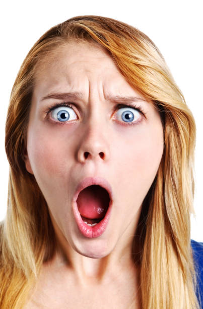 istock Shocked and horrified young blonde glares at camera 979358152