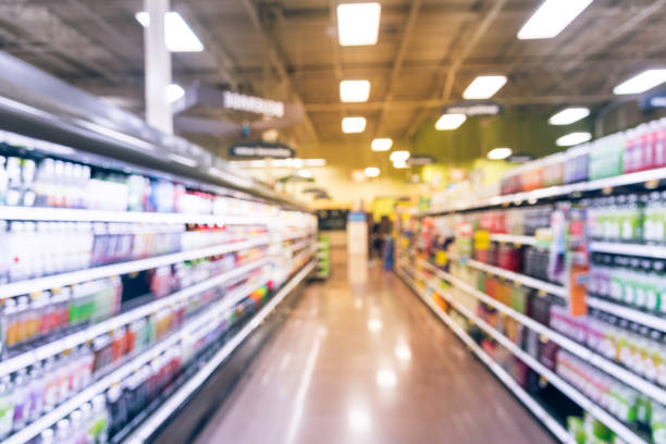 istock Vintage blurred beverage display on shelf and cold freezer 979360922