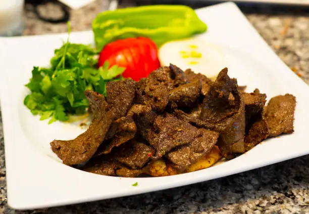 pan liver (leaf liver).  "Edirne / Turkey" is a regional dish. Beef is made from liver. It is cut in leaf form. mixed with flour. cooked in pan.