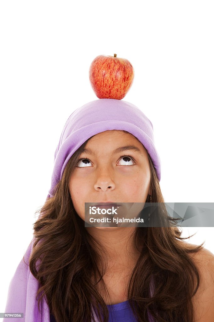 young child with an apple on her head  Adult Stock Photo