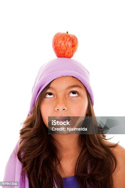 Young Child With An Apple On Her Head Stock Photo - Download Image Now - Adult, Apple - Fruit, Beautiful People