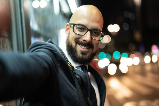 Business man Taking a Selfie at Night