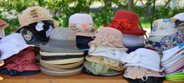 istock Cute colorful hats on the market stall 979419232
