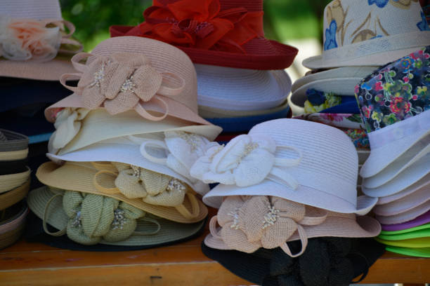 istock Cute colorful hats on the market stall 979419310