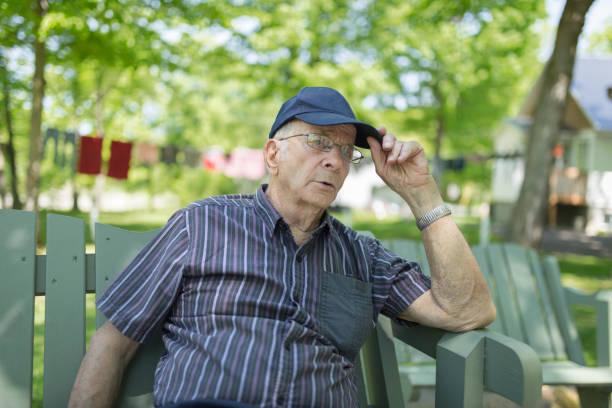 istock Senior men sitting in wood swing 979433548
