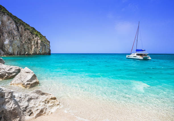 istock Beautiful lagoon and beach with sailing boat in Greece 979438336