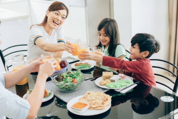 istock Family celebratory toast with fresh juice 979442530