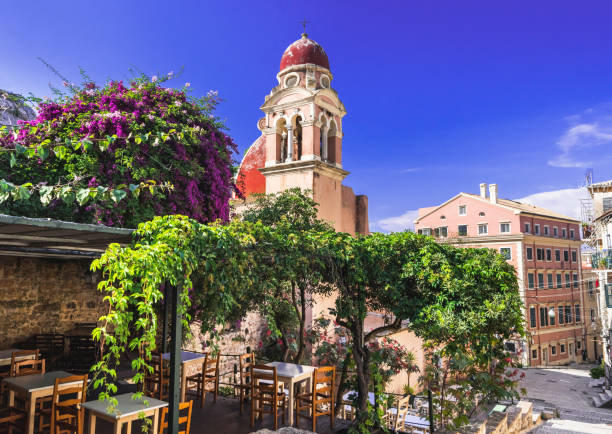 picturesque street in corfu town, greece - greek culture bar restaurant greece imagens e fotografias de stock