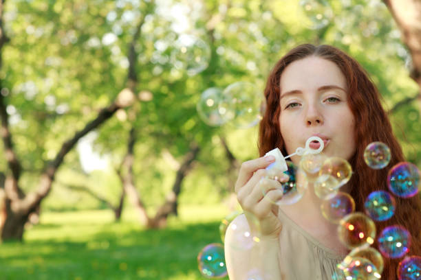 istock Woman and soap bubbles 979448402