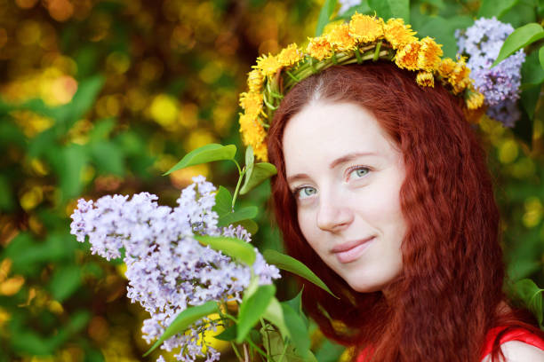 istock Beautiful woman and blooming lilac 979449174
