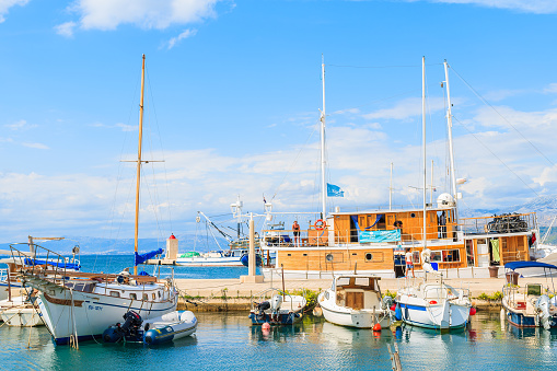 POSTIRA PORT, BRAC ISLAND - SEP 7, 2017: Fishing boats in Postira village with beautiful port, Brac island, Croatia.