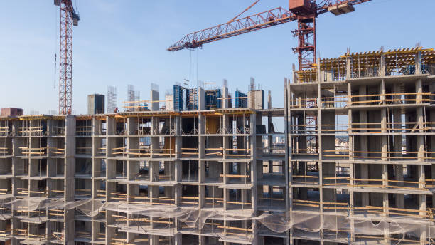 istock Aerial view on the building with construction cranes 979469348