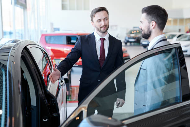 istock Businessman Buying New Car 979470274