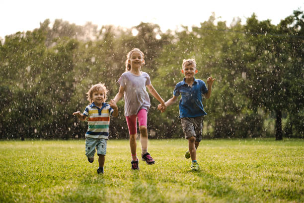 istock Children enjoying running on the rain 979488616
