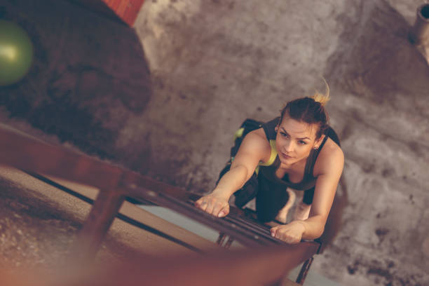 Woman climbing the ladder