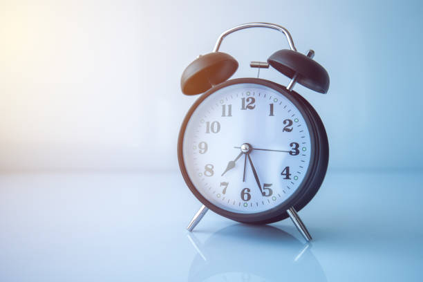 istock Vintage alarm clock showing almost half past seven 979493290