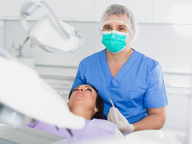 istock dentist in uniform health tooth visitor 979497926