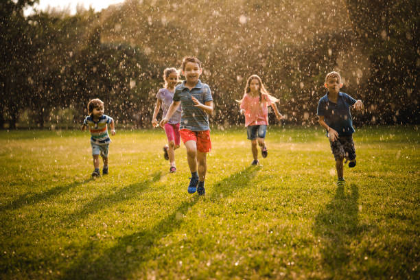 istock Children enjoying running on the rain 979498728