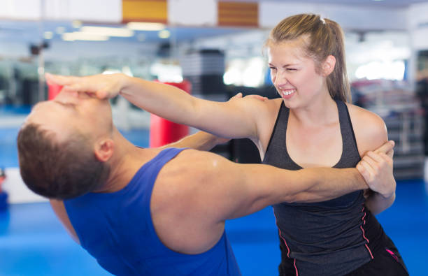 istock Smiling woman is fighting with trainer 979501900