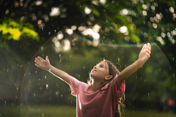 istock Cute girl on the rain 979502542