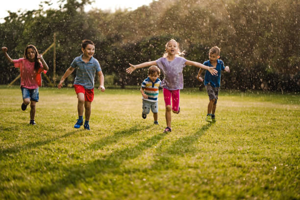 istock Children having fun on the rain 979506934