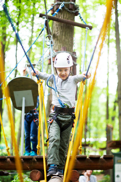 istock The little boy climbing in the rope park 979517694