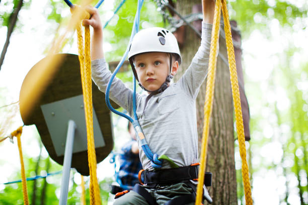 istock The little boy climbing in the rope park 979517896