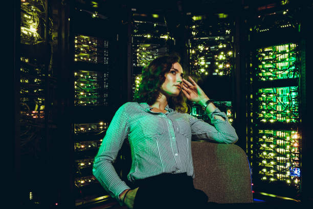 istock Young Woman in Formalwear in Supercomputer Room 979528356