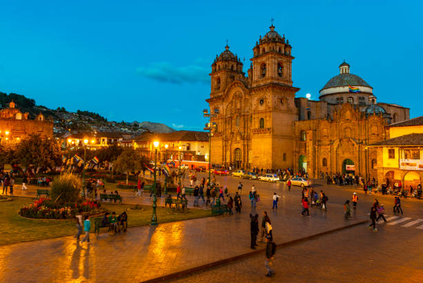 Cusco City at night in Peru Cityscape of the Plaza de Armas, the main square of Cusco city, at night with a big affluence of people during the Inti Raymi Sun Festival back in 2013, Peru, South America. Motion blur of the people in the photography due to a long exposure. inti raymi stock pictures, royalty-free photos & images