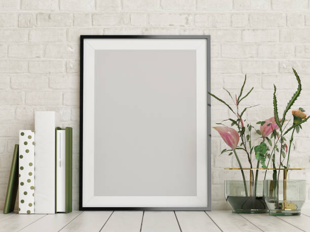 istock Mock up poster, empty frame with flowers and books decor 979550288