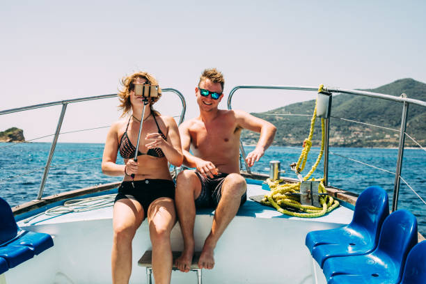 istock Young Couple Taking a Selfie on Boat Trip in Greece 979550592