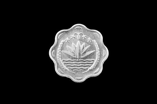 Bangladeshi 5 Poisha steel coin close up isolated on a black background