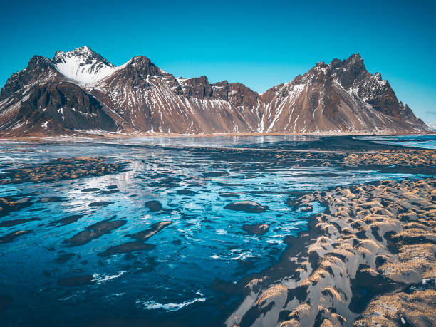 istock Scenic View Of Mountains And Lake 979560690