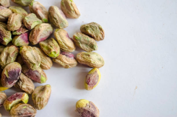 istock Pistachio Nuts shelled and scattered 979562992