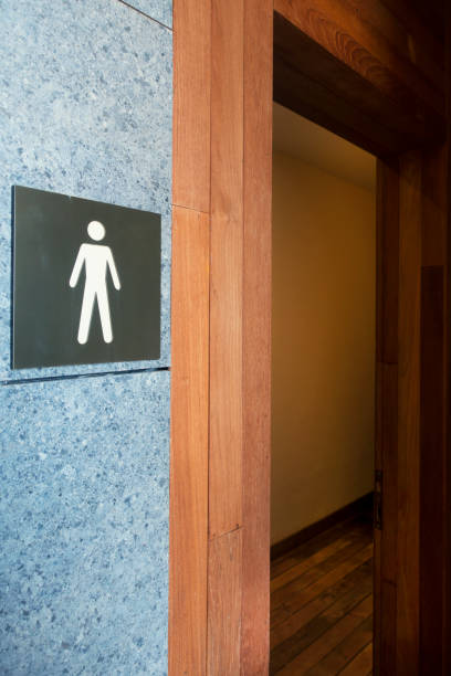 istock Toilet sign on stone wall background 979563554