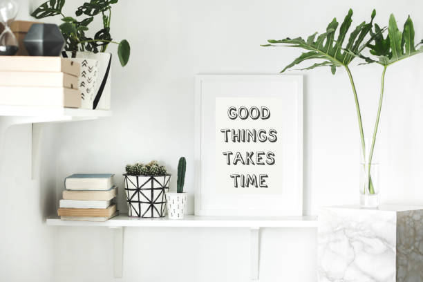 istock Home interior with mock up frame, plants, radio, accessories and modern leafs. Shelf concept in scandi interior. 979566206