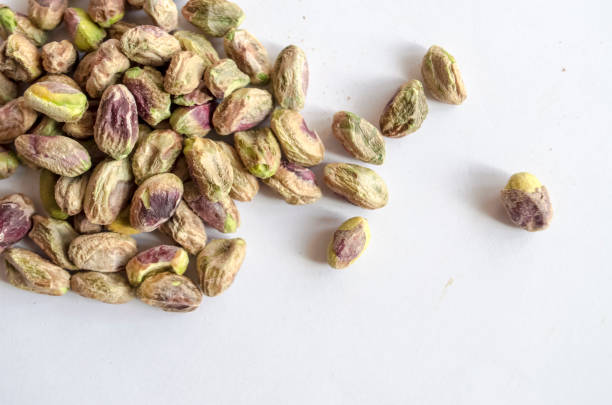 istock Pistachio Nuts shelled and scattered 979566716