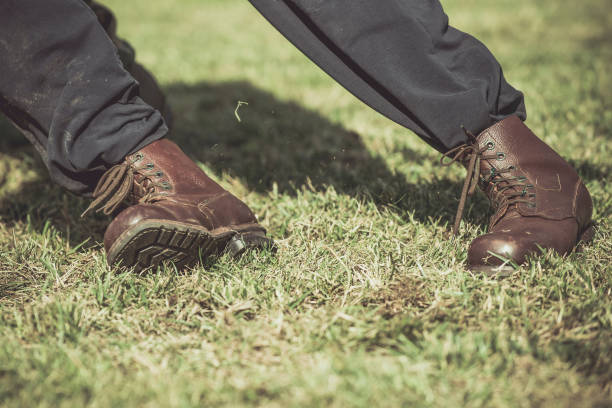 istock Low Section Of Man On Grassy Field 979566966