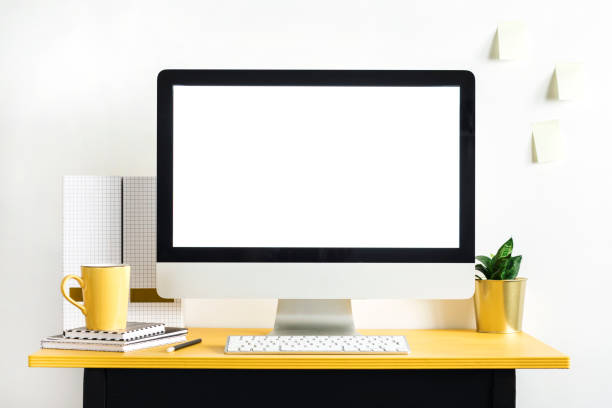 istock Concept of mock up computer screen in the modern scandi office interior. Creative desk of freelancer. Black and yellow desk. 979569750